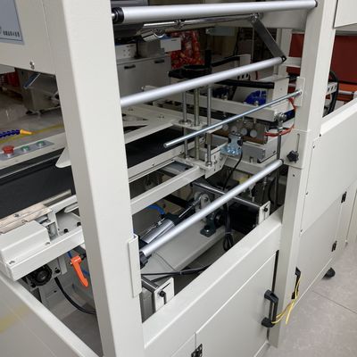 Machine d'emballage de film thermique à rétrécissement entièrement automatique et tunnel de rétrécissement pour l'emballage des boîtiers