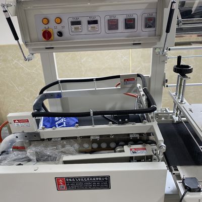 Machine d'emballage de film thermique à rétrécissement entièrement automatique et tunnel de rétrécissement pour l'emballage des boîtiers