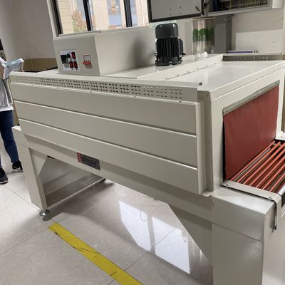 Machine d'emballage de film thermique à rétrécissement entièrement automatique et tunnel de rétrécissement pour l'emballage des boîtiers