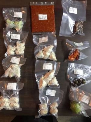 Machine d'emballage sous vide de viande pour sacs de 1 kg dans une double chambre